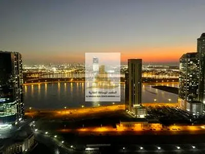 One-bedroom apartment with a living room for rent in Al palm Tower 1 full view of Al Mamzar