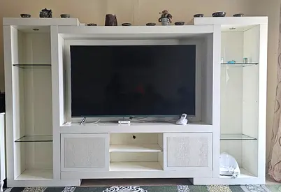 White wooden entertainment center / TV unit with glass shelves
