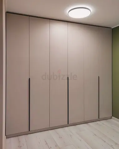 Modern built-in 6-door wardrobe - beige finish, sleek vertical handles