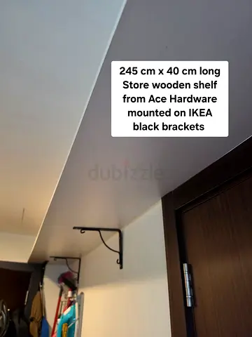 245 cm Ace Hardware wooden storage shelf with black IKEA brackets