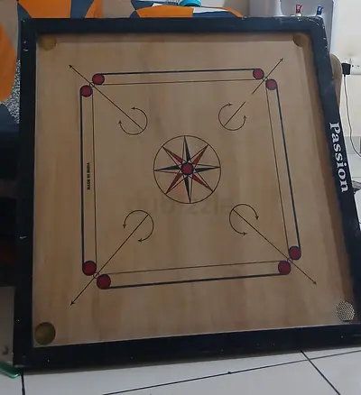 Carrom board with coins