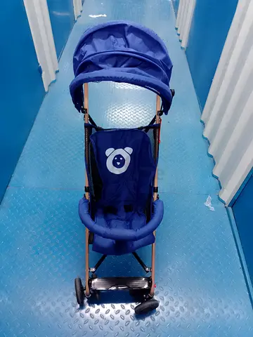 Lightweight blue umbrella stroller in good used condition