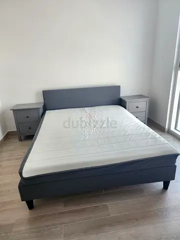 Grey fabric double bed frame with headboard and mattress - good condition