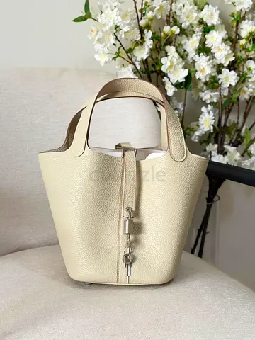 Beige textured leather bucket handbag - compact everyday tote