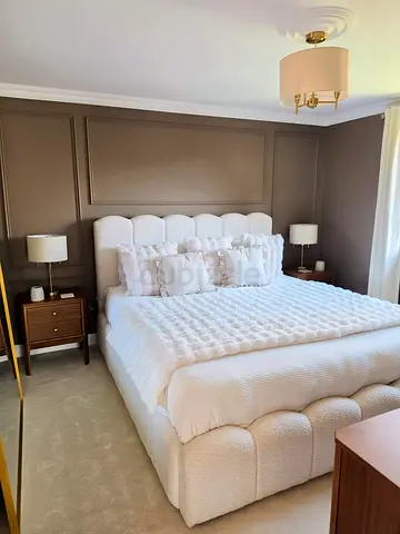 Plush upholstered queen-size bed with headboard and base (Ivory)