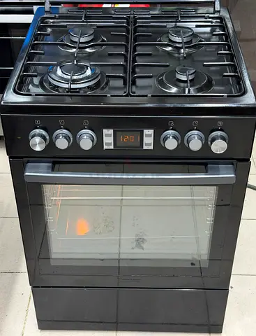 Black freestanding 4-burner gas cooker with electric oven