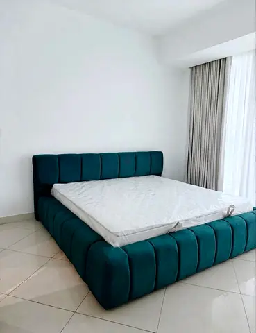 Teal upholstered platform bed with padded headboard - Brand New