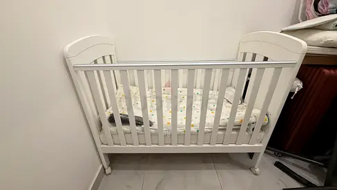 Giggles white wooden baby crib / cot , actually we bought but never used.