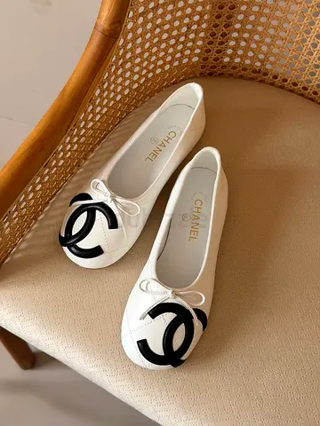 White ballet flats with black CC logo - size not specified