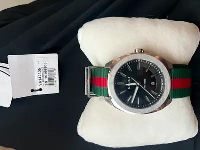 Gucci men's watch with green-red nylon strap, like-new with tag