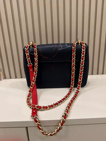 Original Navy leather Carolina Herrera shoulder bag with red-gold chain strap.