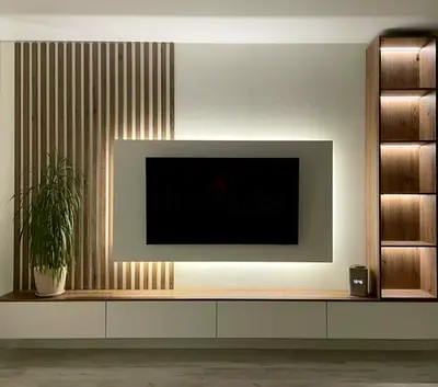 Modern wall-mounted entertainment unit with LED backlight and display shelves