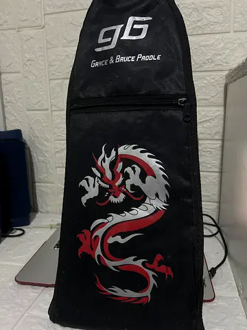 Dragon-print Game & Bruce Paddle Bag — Good Condition