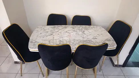 Marble-top dining table with 6 black velvet chairs - excellent condition