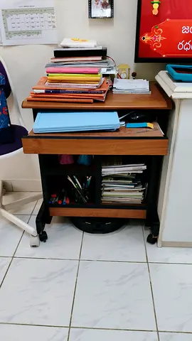 Small mobile wooden study table with storage on wheels