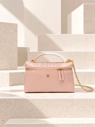 Light pink Chanel vanity bag with gold chain strap