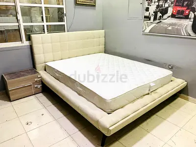 Queen fabric platform bed with mattress and padded headboard