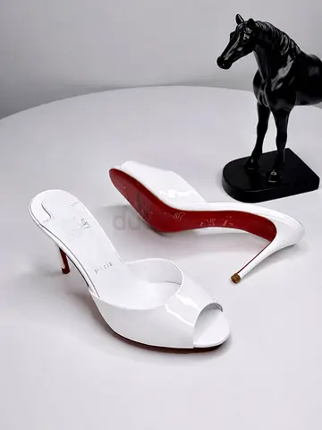 White patent peep-toe stiletto heels, size not marked