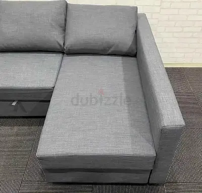 Grey L-shaped fabric sofa with chaise lounge