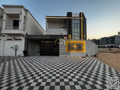 Villa for sale in Ajman | Al Helio 2 area | 4 bedrooms, a majlis, 2 living rooms, and a swimming pool | Freehold | Price includes registration fees an