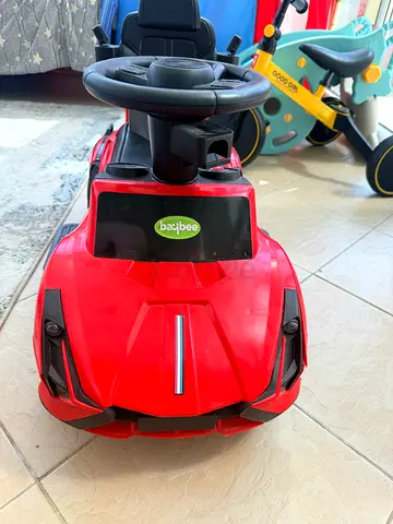 Red push ride-on car for toddlers with steering wheel