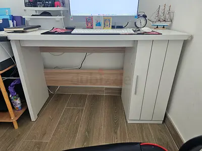 Compact white wooden study desk with side cabinet