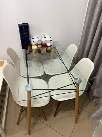 Glass Top Dining Table with 4 White Modern Chairs — Good Condition