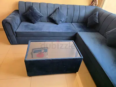 L-shaped navy velvet sectional sofa with ottoman - good condition
