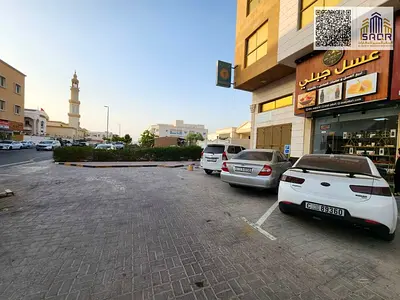 A distinctive apartment for annual rent in Ajman, featuring two rooms, a living room, and two bathrooms.