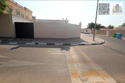 Villa for sale in Al Mansoura, Sharjah; prime location, stone façade, and super-deluxe finishing.