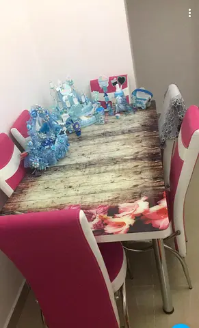 Dining table with 4 pink high-back chairs - used