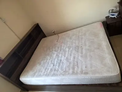 Queen bed frame with mattress and bedside table - used