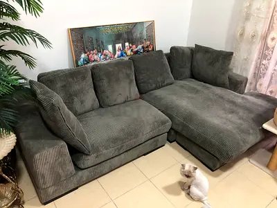 Comfortable L-shaped grey corduroy sofa with chaise - good condition