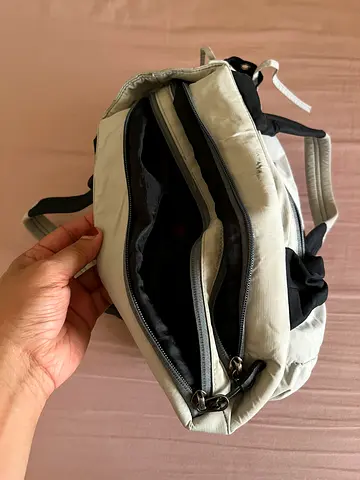 Light grey compact with multiple zip compartments
