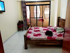 Fully furnished big room with big balcony near NMC/LLH electra street madinat zayed