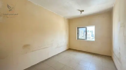 A prime residential opportunity in Al Rashidiya a 2-bedroom apartment with a living room for annual rent located behind Falcon Towers