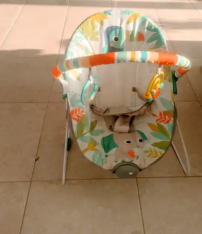 Vibrating Baby bouncer with toy bar — lightly used, Rainforest vibes print