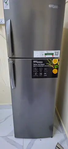 Silver double-door refrigerator in good working condition-super general