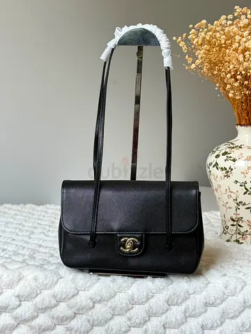 Classic black shoulder bag with gold hardware - good condition