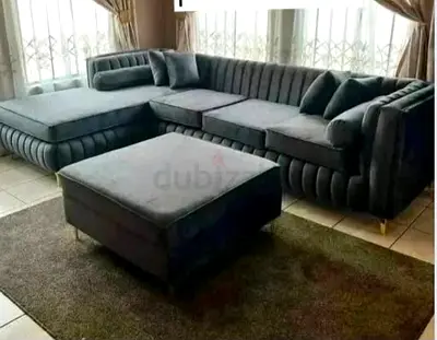 L-shaped velvet sectional sofa with ottoman - charcoal grey