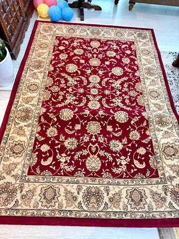 Classic red and beige floral area rug - good condition