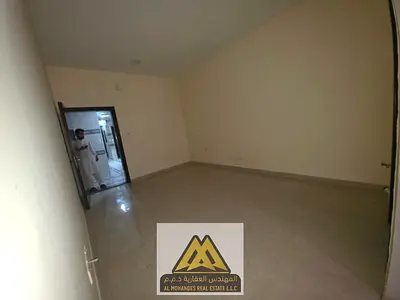 Spacious studio for annual rent in Al Jurf 2, Ajman | Semi-separate kitchen | Central A/C | Free maintenance | Near Al-Aqsa School | Easy exit access