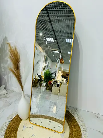 Full-length arched floor mirror