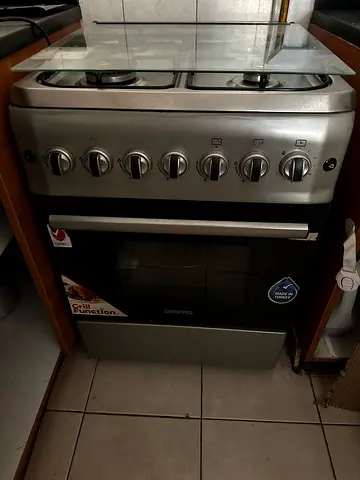Used freestanding gas stove with oven, stainless steel, good working condition