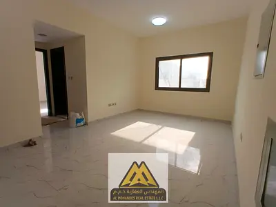 Spacious 1BR in Al Nuaimiya 2, Ajman with 2 bathrooms, central AC, large layout, and a family-frien