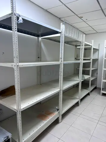 Industrial heavy-duty metal shelving racks — used, sturdy storage units