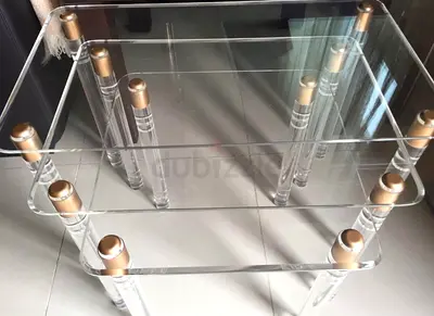 Plexi nestling tables with gold finish