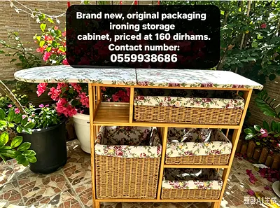 Brand new ironing storage cabinet with floral padded top and wicker baskets