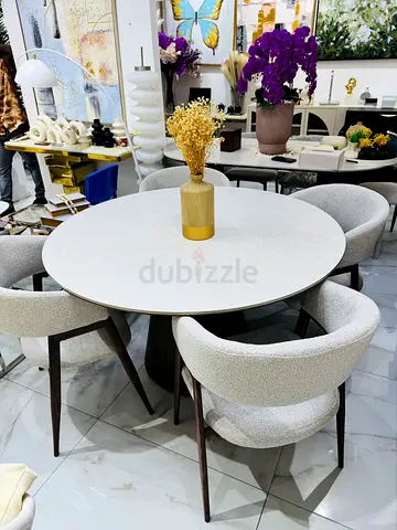 Round dining table with 4 upholstered chairs