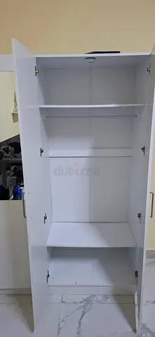 White Wall-Mounted Storage Cabinet with Fold-Down Door - Good Condition